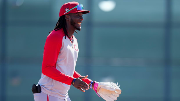 Feb 20, 2024; Goodyear, AZ, USA; Cincinnati Reds third baseman Elly De La Cruz (44) smile during fielding drills during spring training workouts at Goodyear Ballpark. Mandatory Credit: Kareem Elgazzar-USA TODAY Sports  